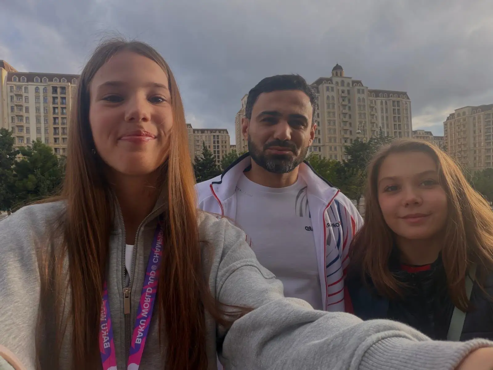 Melissa and two people in a selfie outdoors