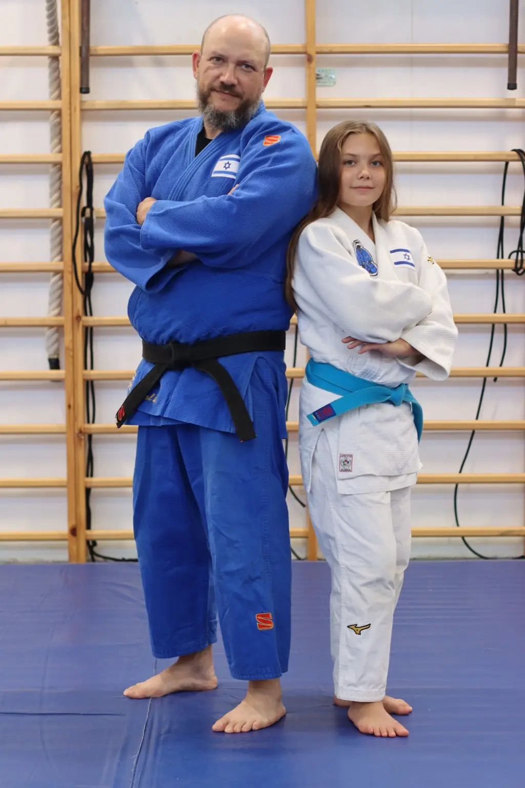 Melissa with her father and coach on the judo mat